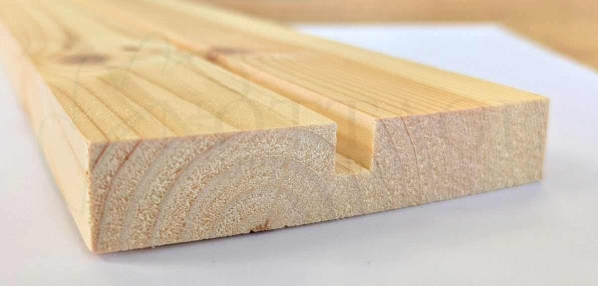 Timber pulley style component for traditional sash windows, showing grooved profile